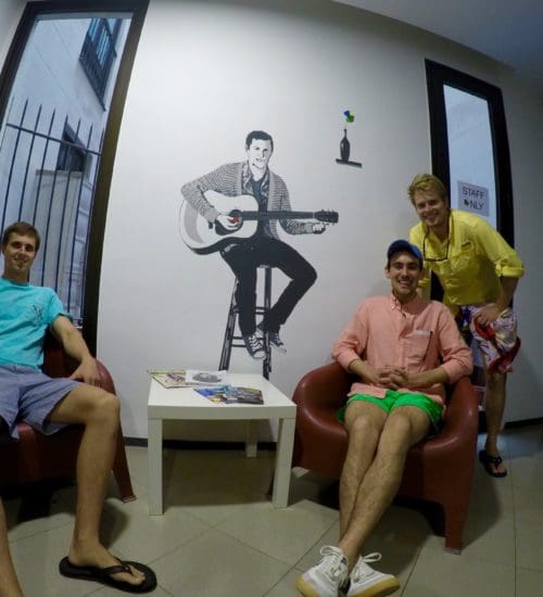 three guys sitting at hostel in barcelona with comfy beds