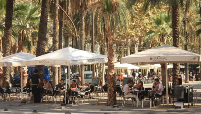 people sitting in the el raval district barcelona